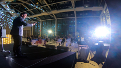 Magician Aaron Paterson performs for AMJ Campbell at Toronto's Hotel x.  This photo is taken of Aaron onstage with the audience in front of him.