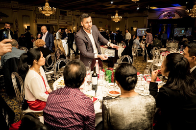 Aaron Paterson performs interactive magic for guests at a recent Black and McDonald Event.