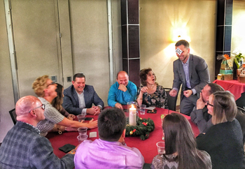 Aaron Paterson was recently the magician for an exlcusive members event at the Georgian Bay golf club in Clarksburg Ontario.  In this photos guests react to an amazing magic trick that Aaron Paterson performs.