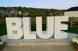 A sign that says Blue at Blue Mountain Village north of Toronto where magician Aaron Paterson recently performed